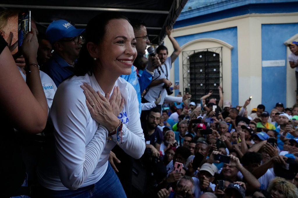 FILE - Opposition presidential hopeful Maria Corina Machado gestures to supporters during a rally in Valencia, Carabobo state, Venezuela, Thursday, Oct. 5, 2023. (AP Photo/Ariana Cubillos, File)
