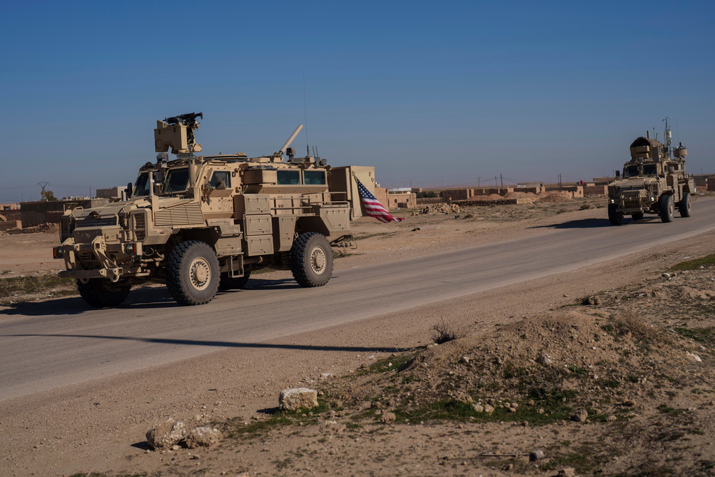 FILE - A U.S. military convoy drives along a road in northeastern Syria's Hasakeh province, Thursday, Jan. 30, 2025. (AP Photo/Bernat Armangue, File)