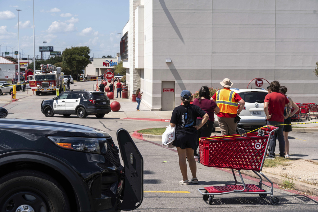 Law enforcement investigates a shooting at Target off Research Boulevard, near Ohlen Road in Austin, Texas, Monday, Aug. 11, 2025. (Mikala Compton/Austin American-Statesman via AP)