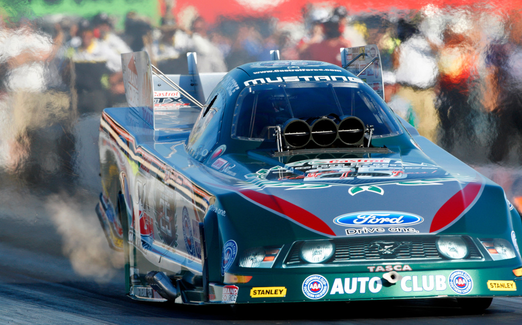 FILE - NHRA driver John Force drives during qualifying for the NHRA Fram Autolite Nationals drag races, July 16, 2010, at Infineon Raceway in Sonoma, Calif. (AP Photo/Ben Margot, File)