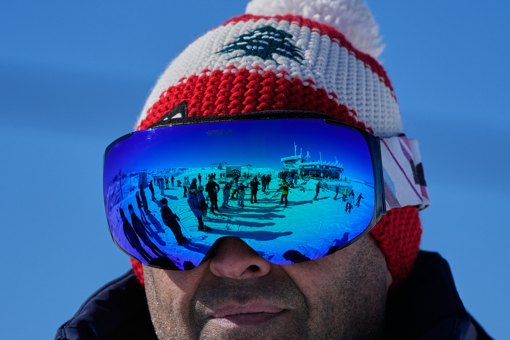 Skiers are mirrored in snow glasses in the Kfardebian-Mzaar ski resort, northeast of Beirut, Lebanon, Saturday, Jan. 3, 2026. (AP Photo/Hassan Ammar)