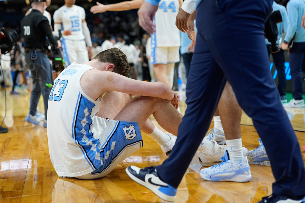 North Carolina center Henri Veesaar (13) dejects after a loss in over time to Virginia Commonwealth during the first round of the NCAA college basketball tournament, Thursday, March 19, 2026, in Greenville, S.C. (AP Photo/Brynn Anderson)