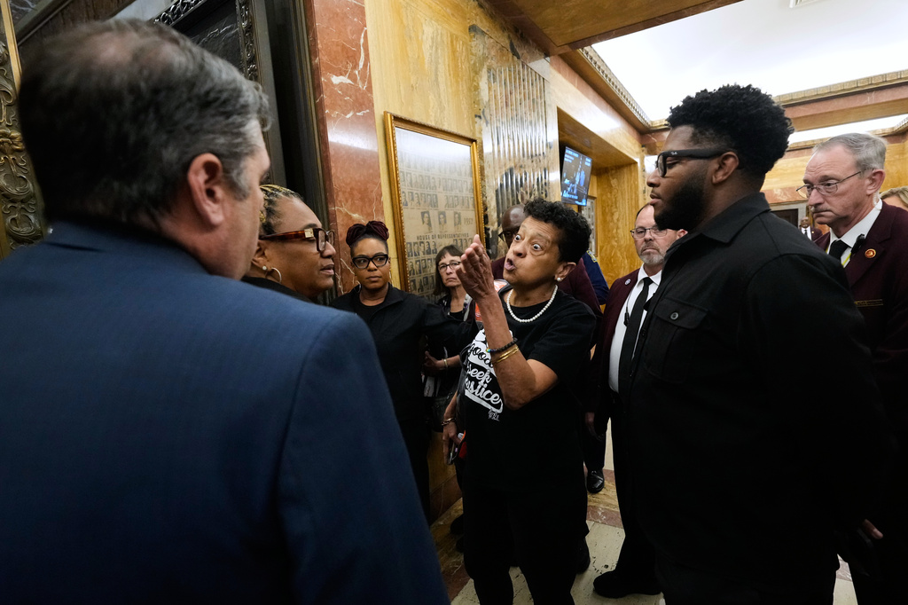 A person opposed to the redistricting plan reacts as she leaves the Louisiana House chambers after the plan to eliminate a majority-Black congressional district, in response to a U.S. Supreme Court ruling, was passed in Baton Rouge, La., Thursday, May 28, 2026. (AP Photo/Gerald Herbert)