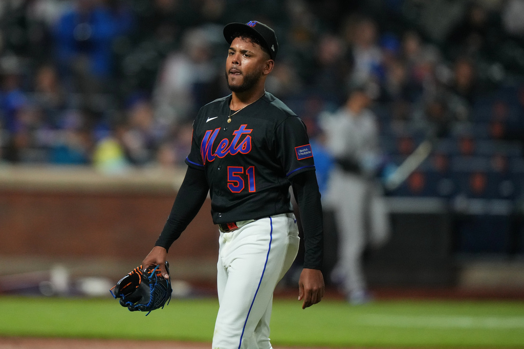 New York Mets pitcher Freddy Peralta (51) leaves during the sixth inning of a baseball game against the Colorado Rockies Friday, April 24, 2026, in New York. (AP Photo/Frank Franklin II)