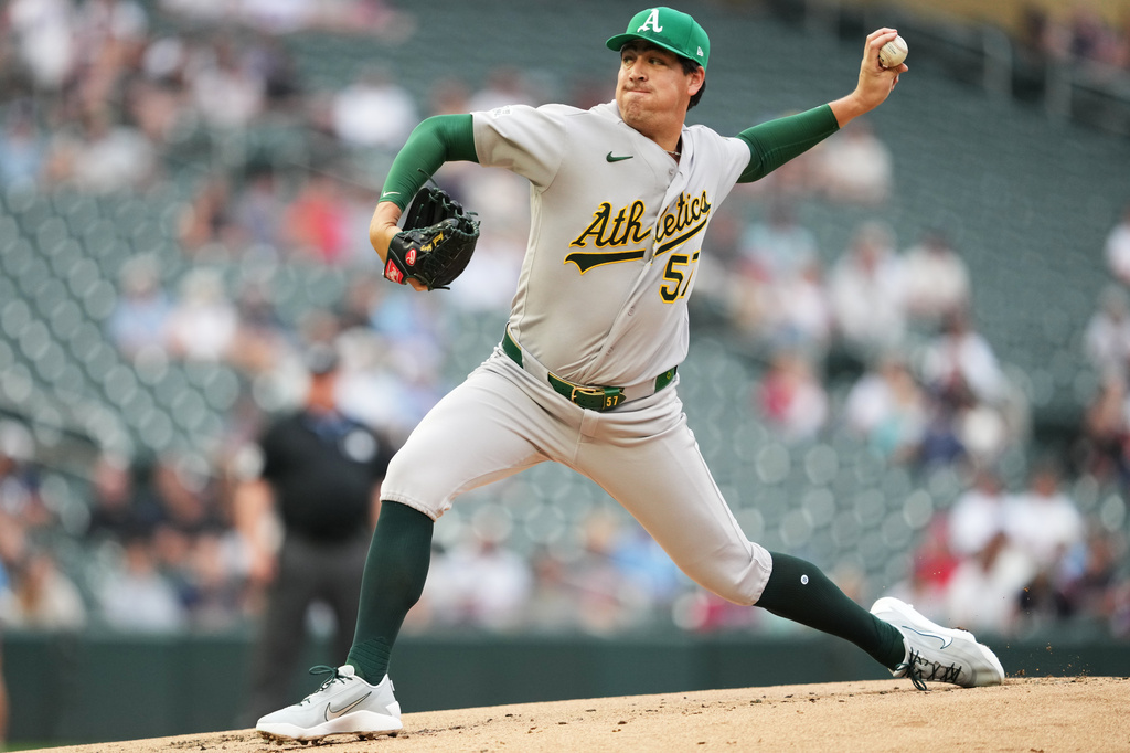 Athletics pitcher Jacob Lopez throws to the Minnesota Twins during the first inning of a baseball game, Friday, July 24, 2026, in Minneapolis. (AP Photo/Ellen Schmidt)