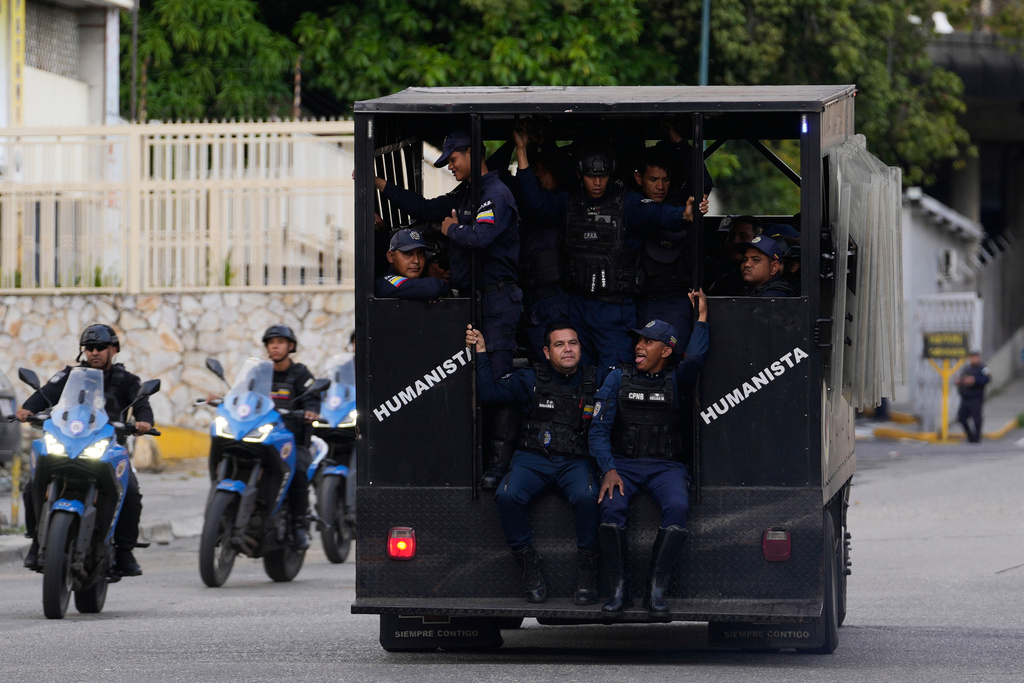 Police patrol near El Helicoide, headquarters of Venezuela's intelligence service and a detention center, in Caracas, Venezuela, Saturday, Jan. 10, 2026.(AP Photo/Matias Delacroix)
