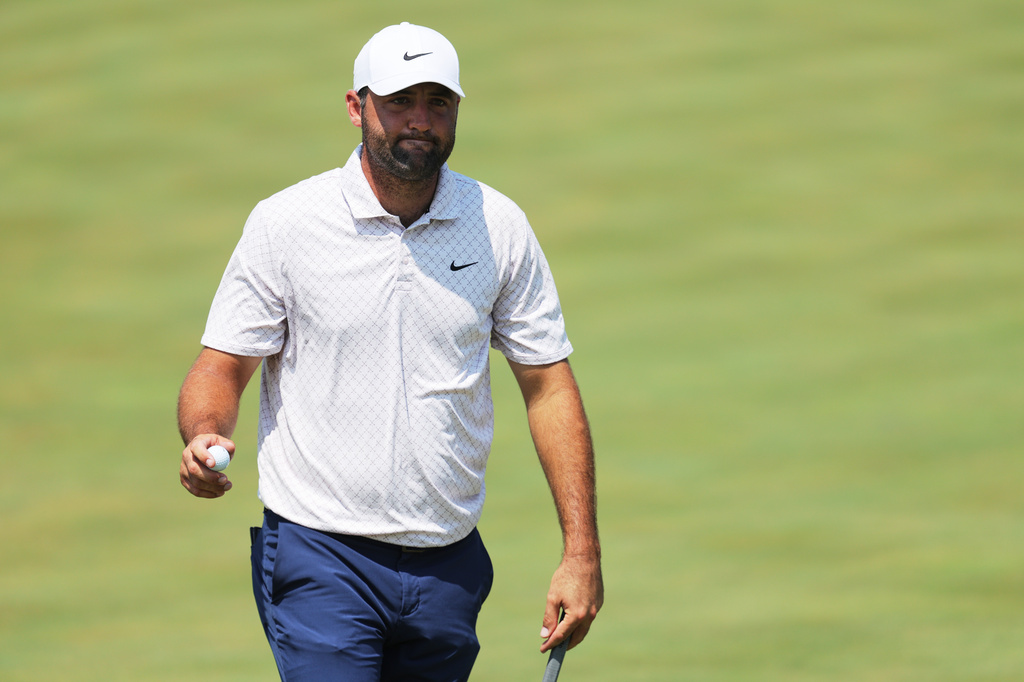 Scottie Scheffler reacts after his shot on the ninth green during the final round of the 3M Open golf tournament at the Tournament Players Club Sunday, July 26, 2026, in Blaine, Minn. (AP Photo/Bailey Hillesheim)