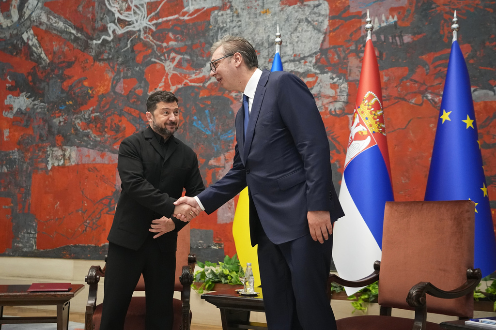 Ukraine's President Volodymyr Zelenskyy, left, shakes hands with his Serbian counterpart Aleksandar Vucic after a welcome ceremony at the Serbia Palace, in Belgrade, Serbia, Saturday, Aug. 8, 2026. (AP Photo/Darko Vojinovic)