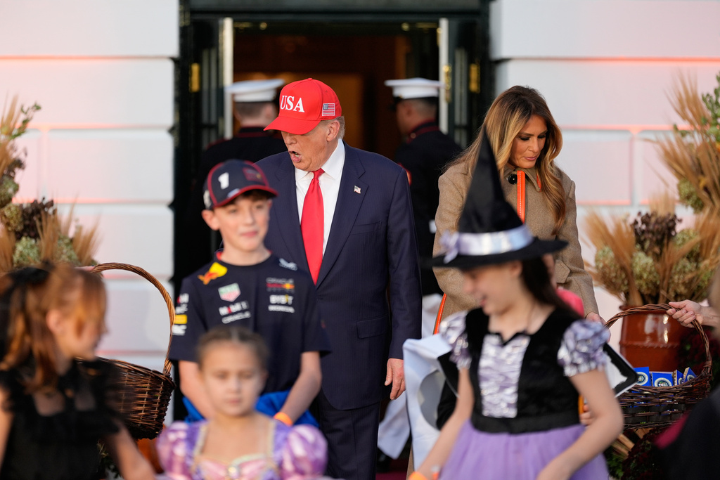 President Donald Trump and first lady Melania Trump arrive to participate in a Halloween at the White House event on the South Lawn, Thursday, Oct. 30, 2025, in Washington. (AP Photo/Alex Brandon)