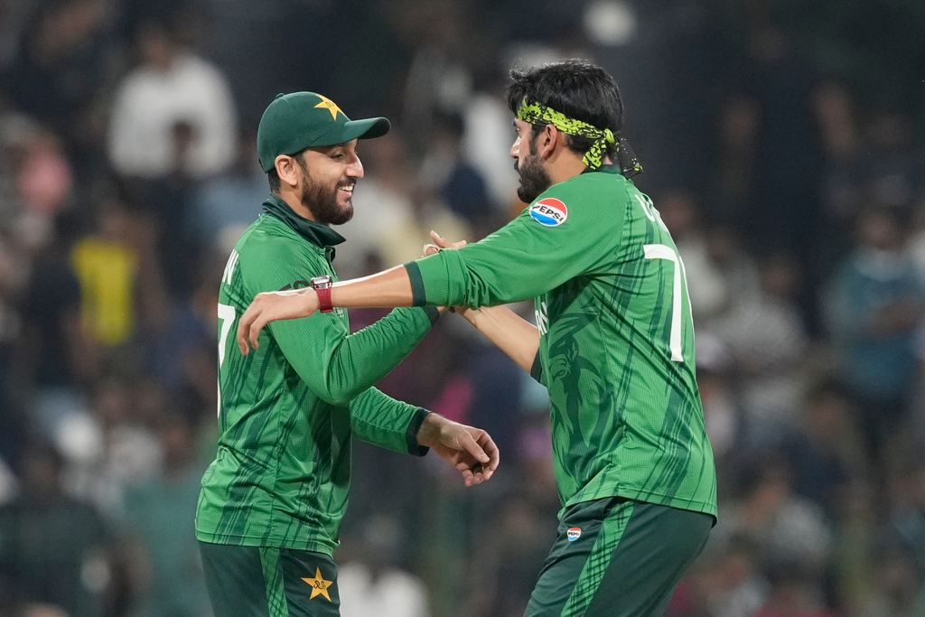 Pakistan's Usman Tariq, right, and Pakistan's captain Salman Agha delegates after they won the T20 World Cup cricket match against the United States in Colombo, Sri Lanka, Tuesday, Feb. 10, 2026. (AP Photo/Eranga Jayawardena)