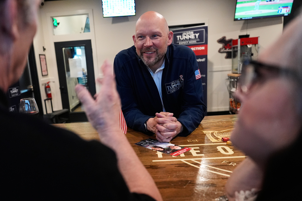 Jason Tunney, Republican candidate for the 35th Senate District, speaks with supporters at Otherside Bar and Grill Monday, April 27, 2026, in Freeland, Mich. (AP Photo/Paul Sancya)