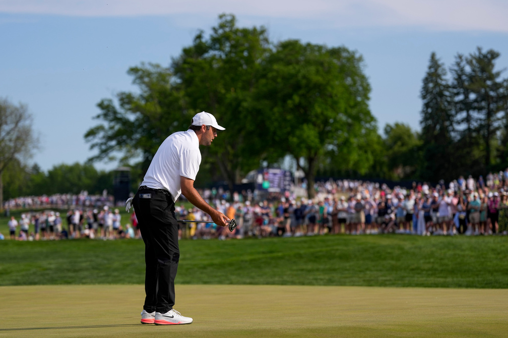Scottie Scheffler reacts to missing a putt on the 17th green during the third round of the PGA Championship golf tournament at Aronimink Golf Club, Saturday, May 16, 2026, in Newtown Square, PA. (AP Photo/Matt Slocum)
