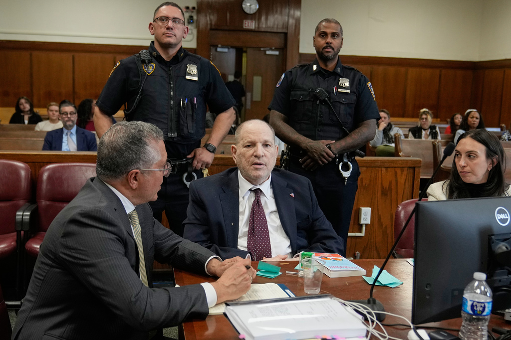 Harvey Weinstein, center, defense attorneys Marc Agnifilo, left, and Teny Geragos, right, appear in criminal court, in New York, Tuesday, April 28, 2026. (AP Photo/Richard Drew, Pool)