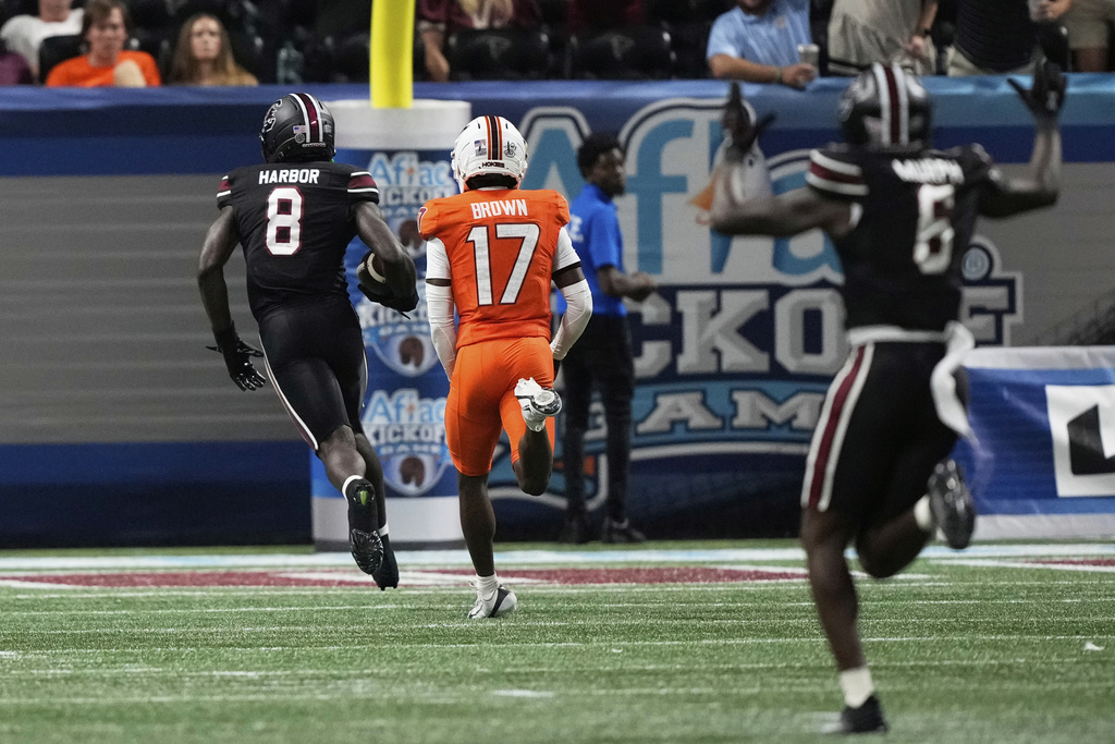 South Carolina wide receiver Nyck Harbor (8) scores in the second half an NCAA college football game against Virginia Tech, Sunday, Aug. 31, 2025, in Atlanta. (AP Photo/Brynn Anderson)