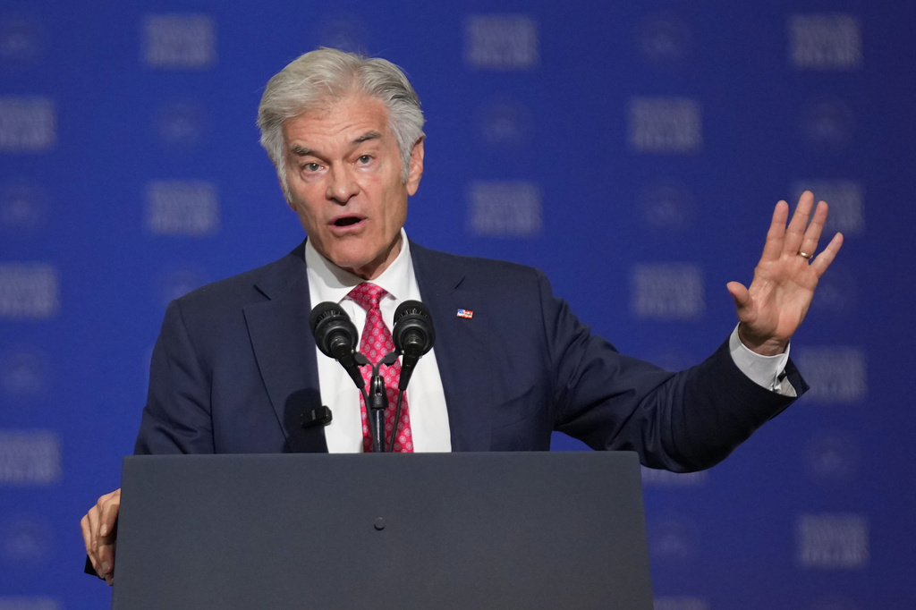 Centers for Medicare & Medicaid Services administrator Dr. Mehmet Oz speaks before Vice President JD Vance at the Wisconsin Air National Guard facility at Milwaukee Mitchell International Airport, Wednesday, July 8, 2026, in Milwaukee. (AP Photo/Mark Schiefelbein, Pool)