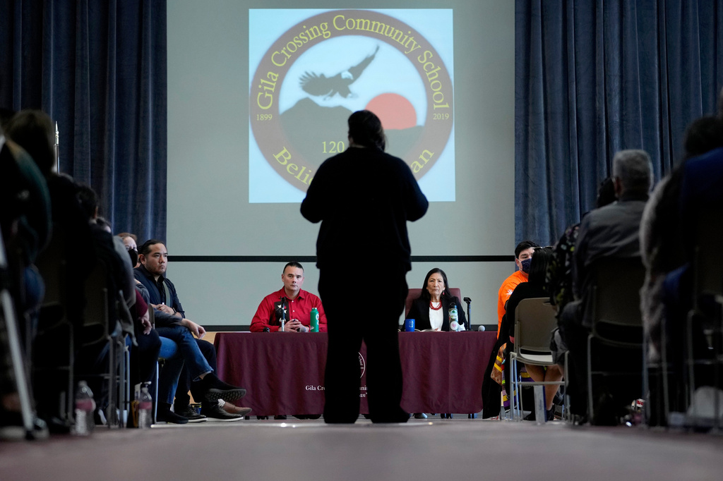 FILE - U.S. Interior Secretary Deb Haaland, right, and Assistant Secretary for Indian Affairs Bryan Newland, left, listen as April Hiosik Ignacio, center, speaks, Jan. 20, 2023, in Laveen, Ariz. (AP Photo/Matt York, File)