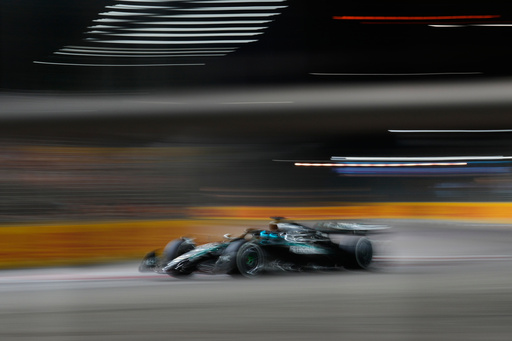 Mercedes driver George Russell of Britain powers his car during the Singapore Formula One Grand Prix at the Marina Bay Street Circuit in Singapore, Sunday, Oct. 5, 2025. (AP Photo/Vincent Thian) Mercedes driver George Russell of Britain powers his car during the Singapore Formula One Grand Prix at the Marina Bay Street Circuit in Singapore, Sunday, Oct. 5, 2025. (AP Photo/Vincent Thian)