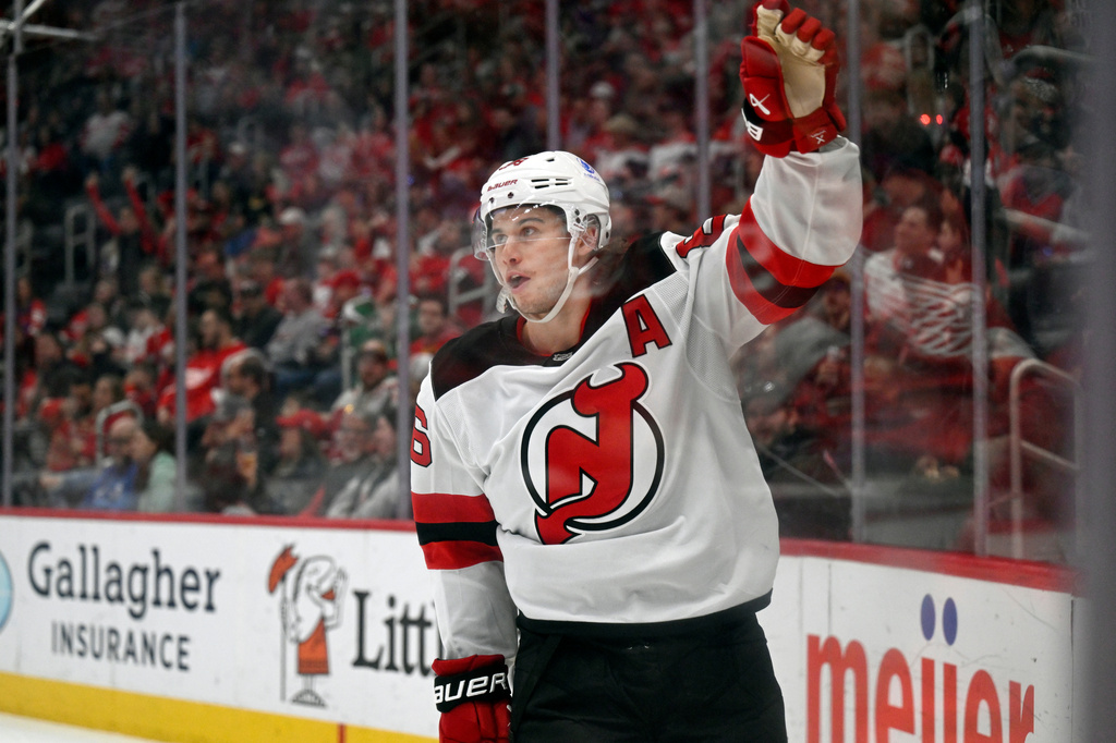 New Jersey Devils center Jack Hughes reacts after scoring during the first period of an NHL hockey game against the Detroit Red Wings, Saturday, April 11, 2026, in Detroit. (AP Photo/Jose Juarez)