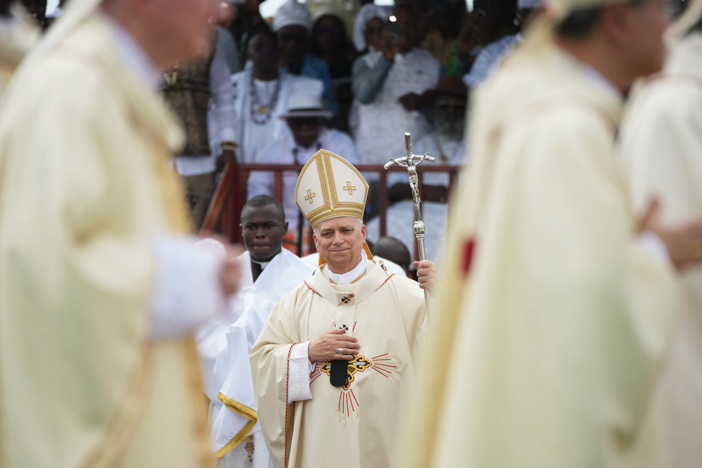 Pope Leo XIV arrives in procession to celebrate Mass at the Japoma Stadium, in Douala, Cameroon, Friday, April 17, 2026 on the fifth day of his 11-day pastoral visit to Africa. (AP Photo/Andrew Medichini)