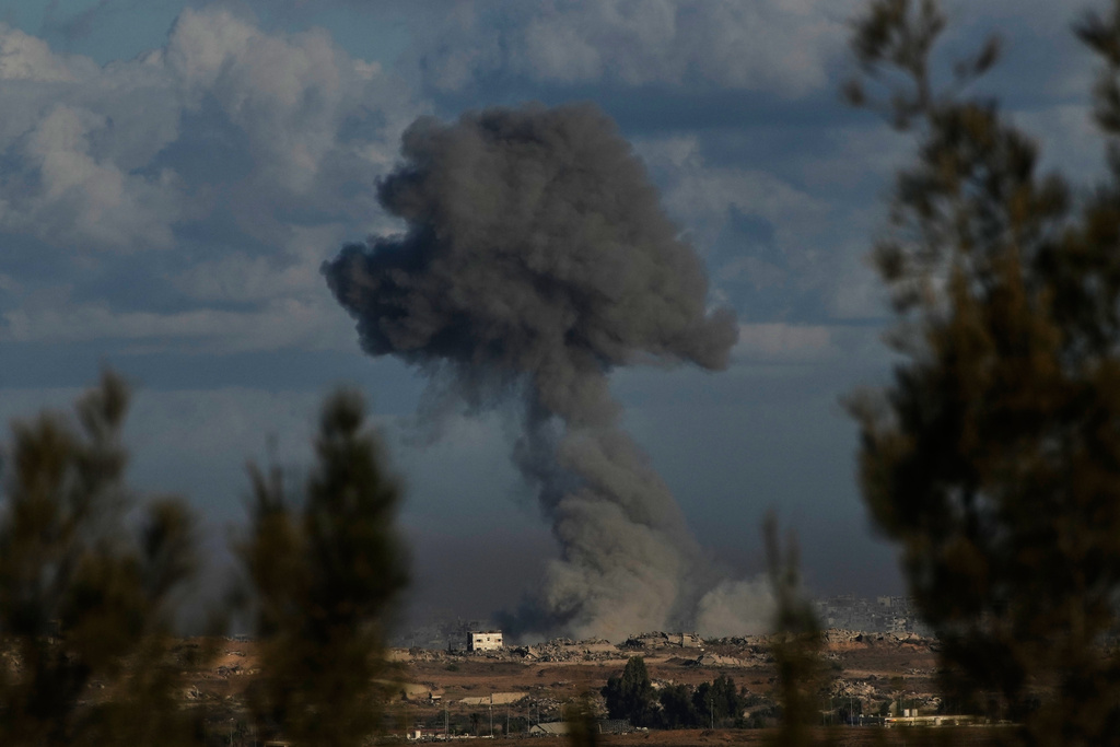 Smoke rises following an Israeli army bombardment in the Gaza Strip, as seen from Kibbutz Kfar Aza, southern Israel, Tuesday, Oct. 7, 2025. (AP Photo/Ohad Zwigenberg)