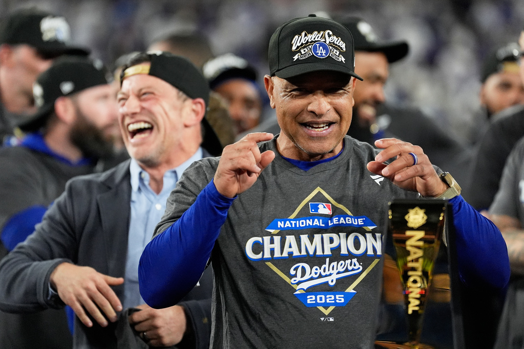 Los Angeles Dodgers manager Dave Roberts celebrates their win against the Milwaukee Brewers in baseball's National League Championship Series, Friday, Oct. 17, 2025, in Los Angeles. (AP Photo/Brynn Anderson)