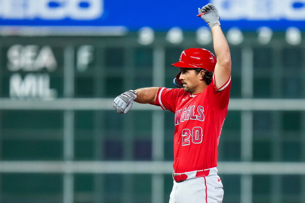 Los Angeles Angels' Adam Frazier reacts after hitting an RBI double against the Houston Astros during the fourth inning of a baseball game Thursday, Aug. 20, 2026, in Houston. (AP Photo/Eric Christian Smith)