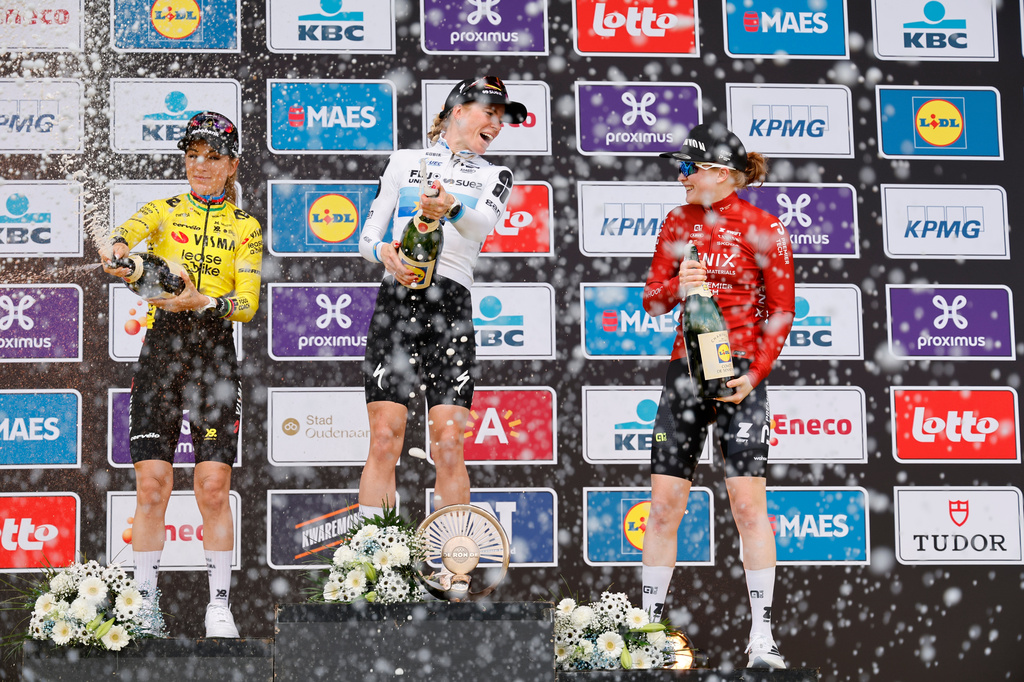 Netherland's Demi Vollering , center, celebrates after winning the Tour of Flanders cycling race, in front off France's Pauline Ferrand-Prevot, left, and Netherland's Puck Pieterse in Oudenaarde, Belgium Sunday, April 5, 2026. (AP Photo/Geert Vanden Wijngaert)