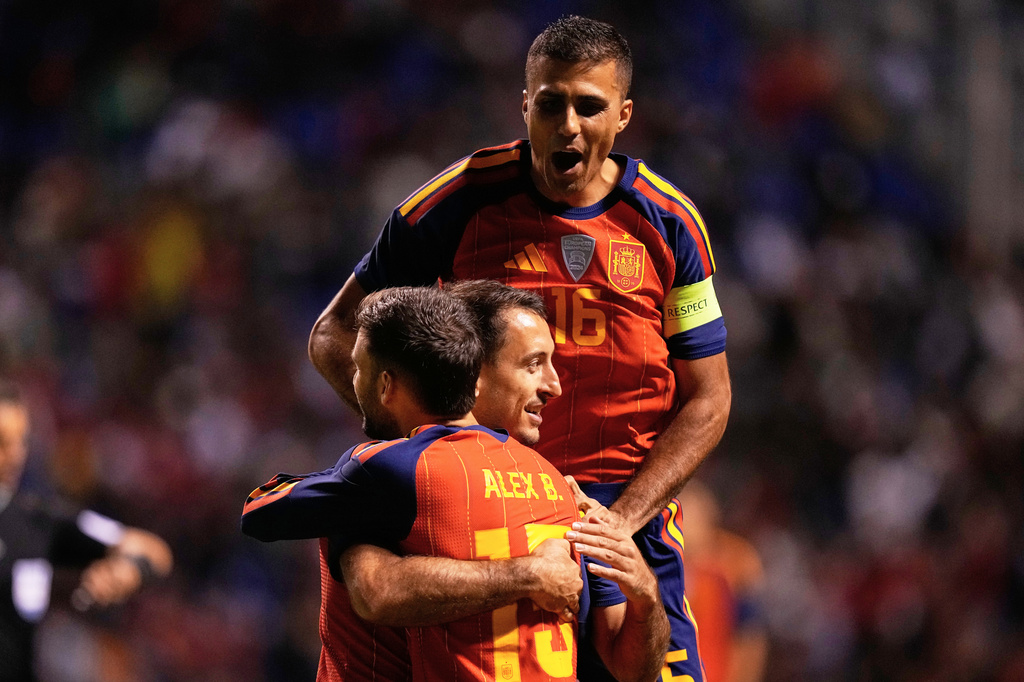 Spain's Mikel Oyarzabal, center, and teammates celebrate their side's opening goal an international soccer match against Peru in Puebla, Mexico, Monday, June 8, 2026. (AP Photo/Fernando Llano)