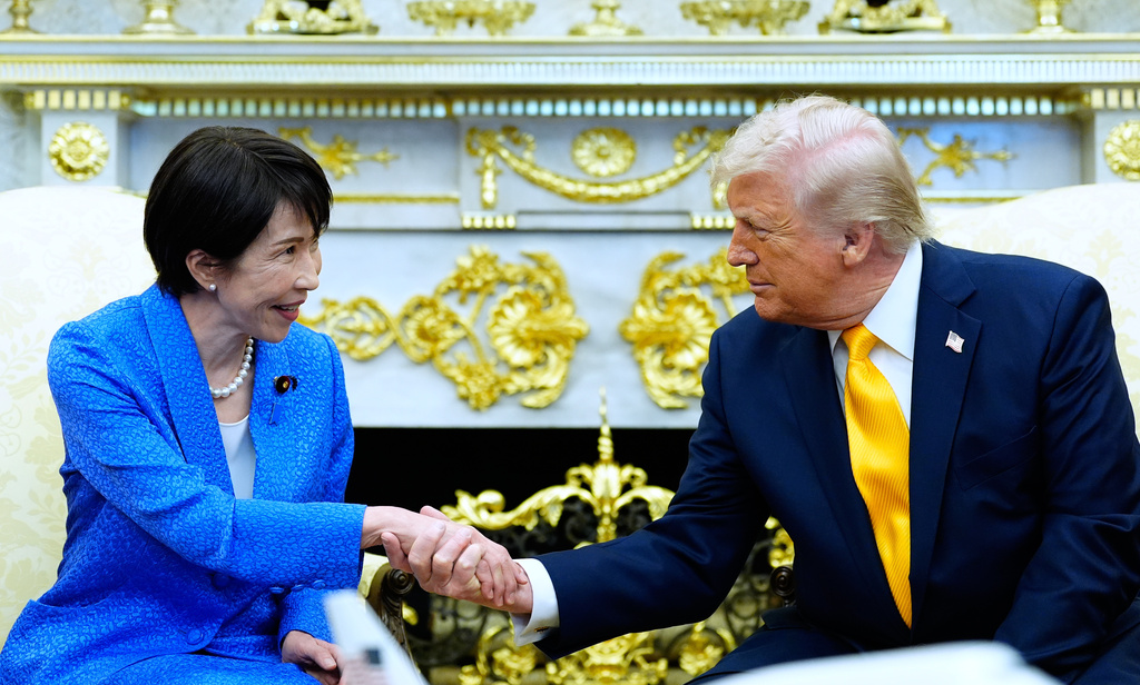 President Donald Trump greets Japan's Prime Minister Sanae Takaichi in the Oval Office of the White House, Thursday, March 19, 2026, in Washington. (AP Photo/Alex Brandon)