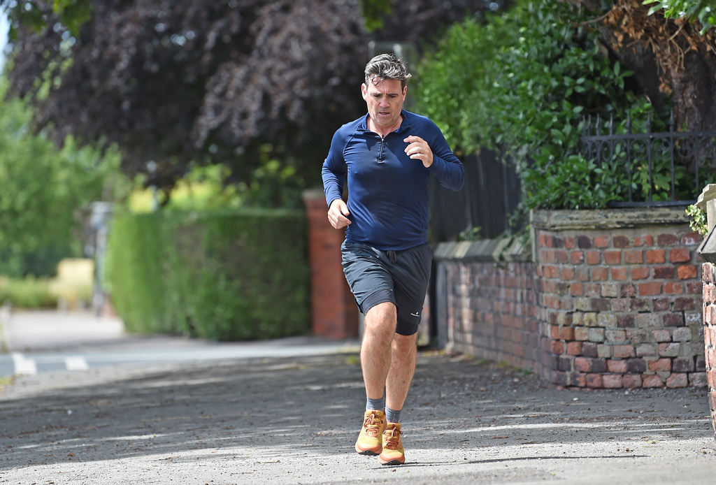 Andy Burnham running near his house in Cheshire, England, Sunday, June 28, 2026. (Peter Powell/PA via AP)