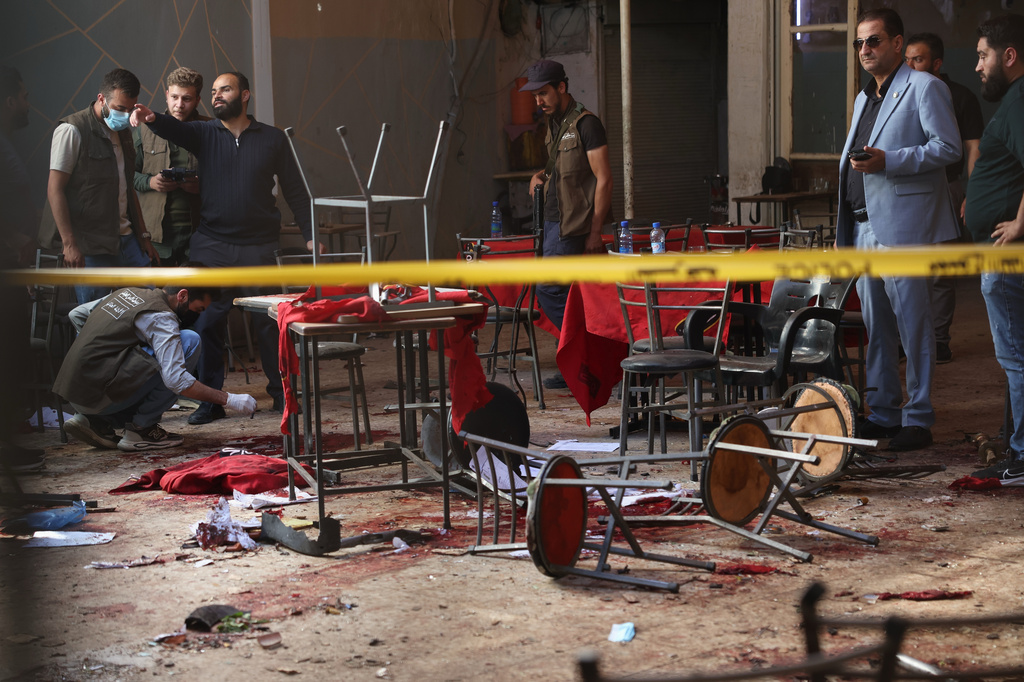 Syrian security inspects the site after an explosive device was detonated in a cafe near the main courthouse complex, in Damascus, Syria, Thursday, July 2, 2026 (AP Photo/Ghaith Alsayed)