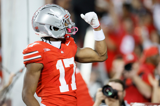 Ohio State receiver Carnell Tate celebrates his touchdown against Minnesota during the first half of an NCAA college football game, Saturday, Oct. 4, 2025, in Columbus, Ohio. (AP Photo/Jay LaPrete) Ohio State receiver Carnell Tate celebrates his touchdown against Minnesota during the first half of an NCAA college football game, Saturday, Oct. 4, 2025, in Columbus, Ohio. (AP Photo/Jay LaPrete)