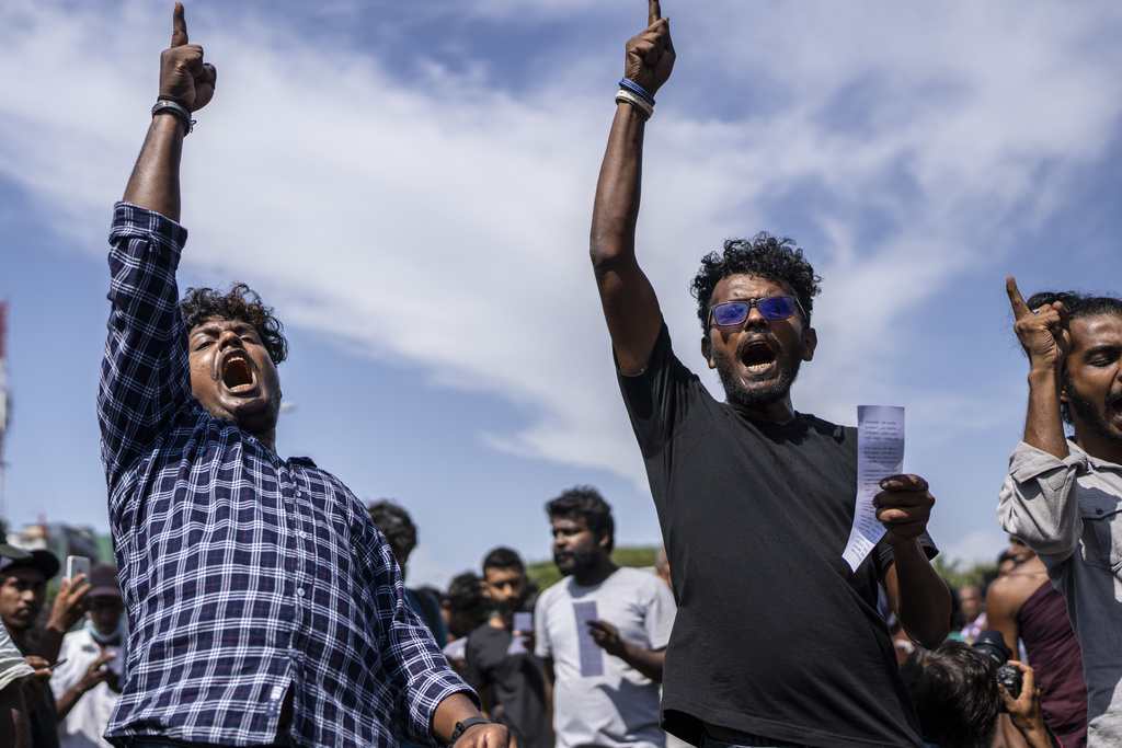 FILE -Protesters shout slogans demanding acting president and prime minister Ranil Wickremesinghe resign in Colombo, Sri Lanka, in Colombo, Sri Lanka, July 19, 2022. (AP Photo/Rafiq Maqbool), File)
