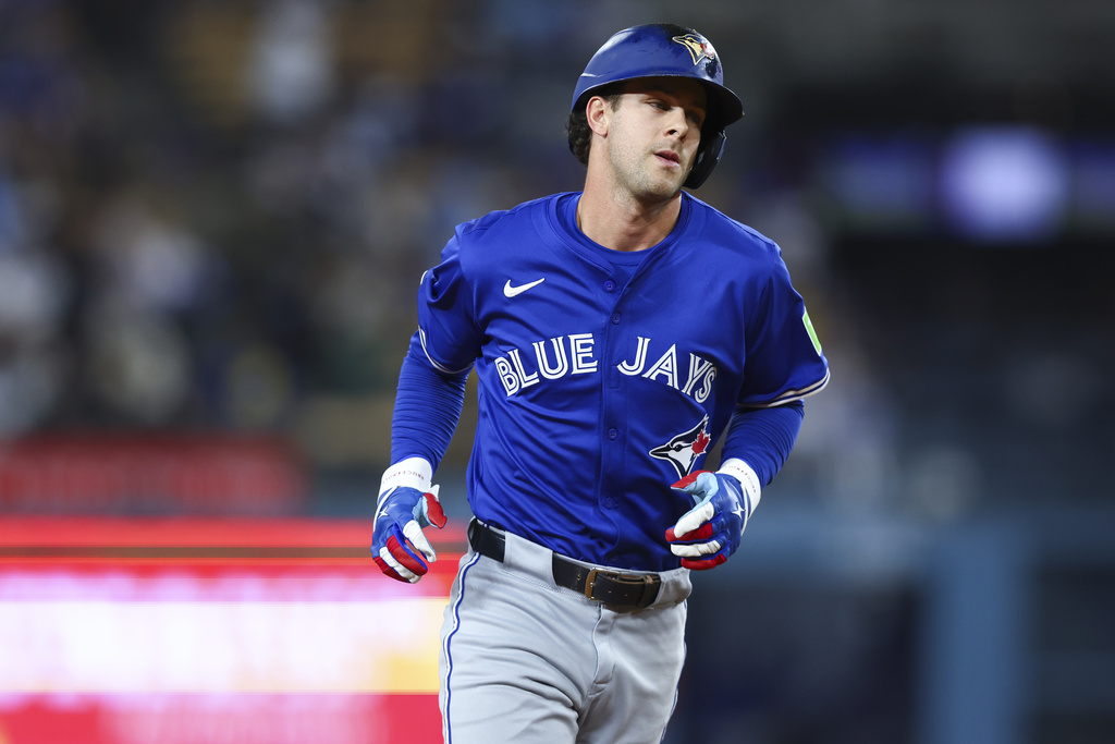 Toronto Blue Jays' Ernie Clement runs the bases after hitting a home run during the eighth inning of a baseball game against the Los Angeles Dodgers, Saturday, Aug. 9, 2025, in Los Angeles. (AP Photo/Jessie Alcheh)