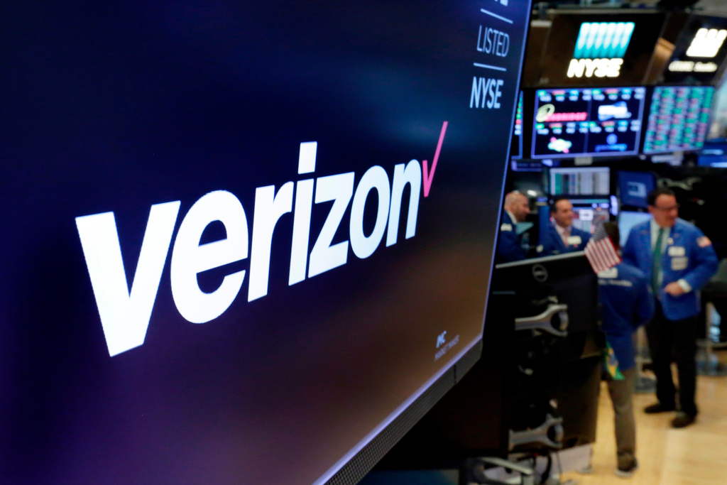 FILE - This April 23, 2018, file photo shows the logo for Verizon above a trading post on the floor of the New York Stock Exchange. (AP Photo/Richard Drew, File)