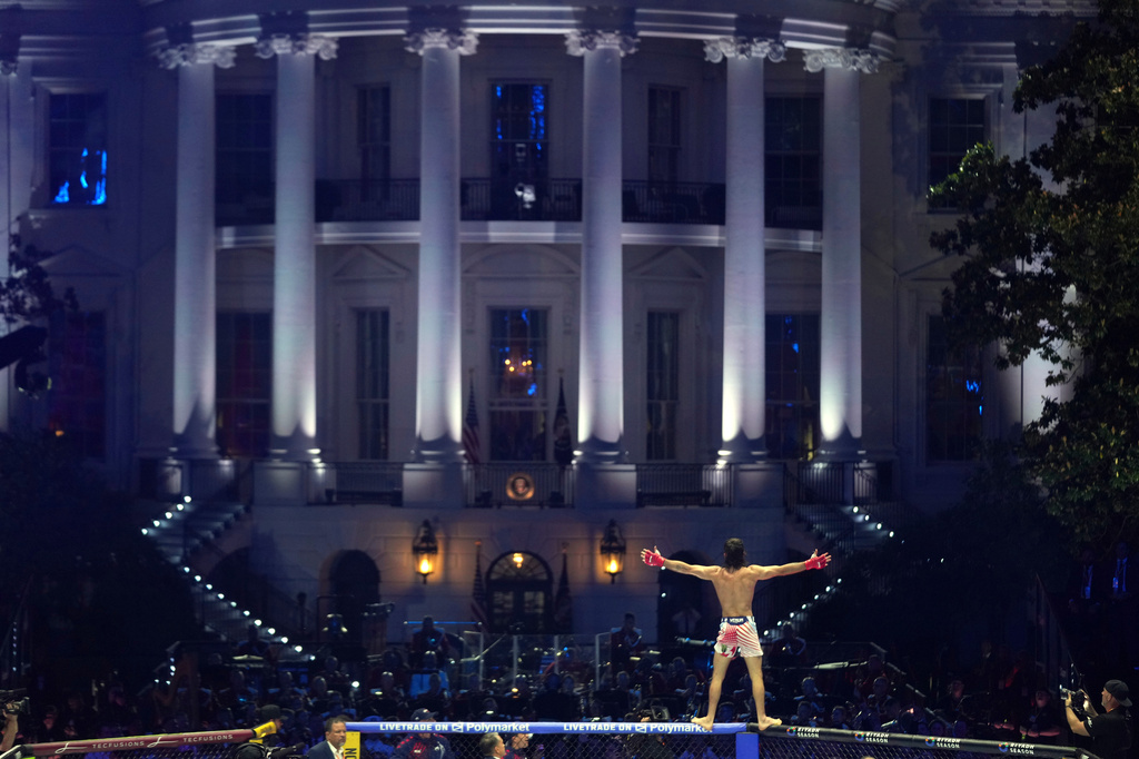 Diego Lopes celebrates during a featherweight bout against Steve Garcia during UFC Freedom 250 on the South Lawn of the White House, Sunday, June 14, 2026, in Washington. (AP Photo/Mark Schiefelbein)