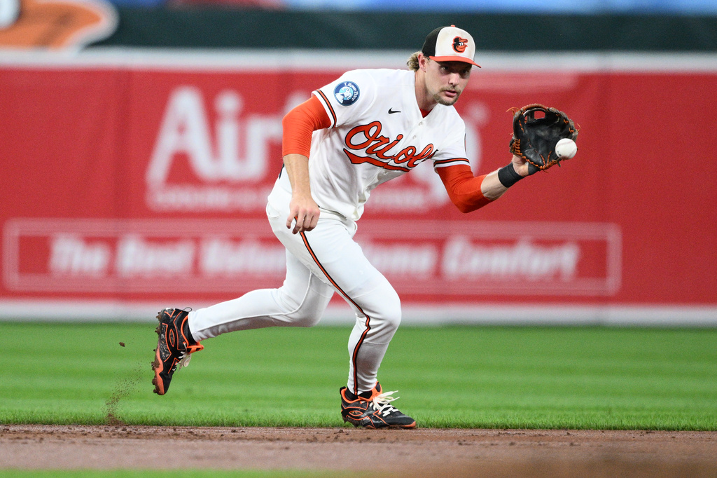Baltimore Orioles shortstop Gunnar Henderson fields a ground ball by Philadelphia Phillies' Bryan de la Cruz during the third inning of a baseball game, Saturday, Aug. 1, 2026, in Baltimore. (AP Photo/Nick Wass)