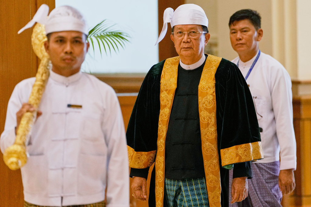 Parliament chairman Aung Lin Dwe, center, arrives for a session of Union Parliament in Naypyitaw, Myanmar, Friday, April 3, 2026. (AP Photo/Aung Shine Oo)