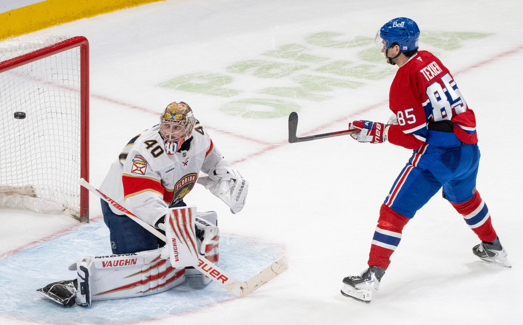 Montreal Canadiens' Alexandre Texier (85) scores on Florida Panthers goaltender Daniil Tarasov (40) during shootout NHL hockey action in Montreal on Tuesday, April 7, 2026. (Christinne Muschi/The Canadian Press via AP)