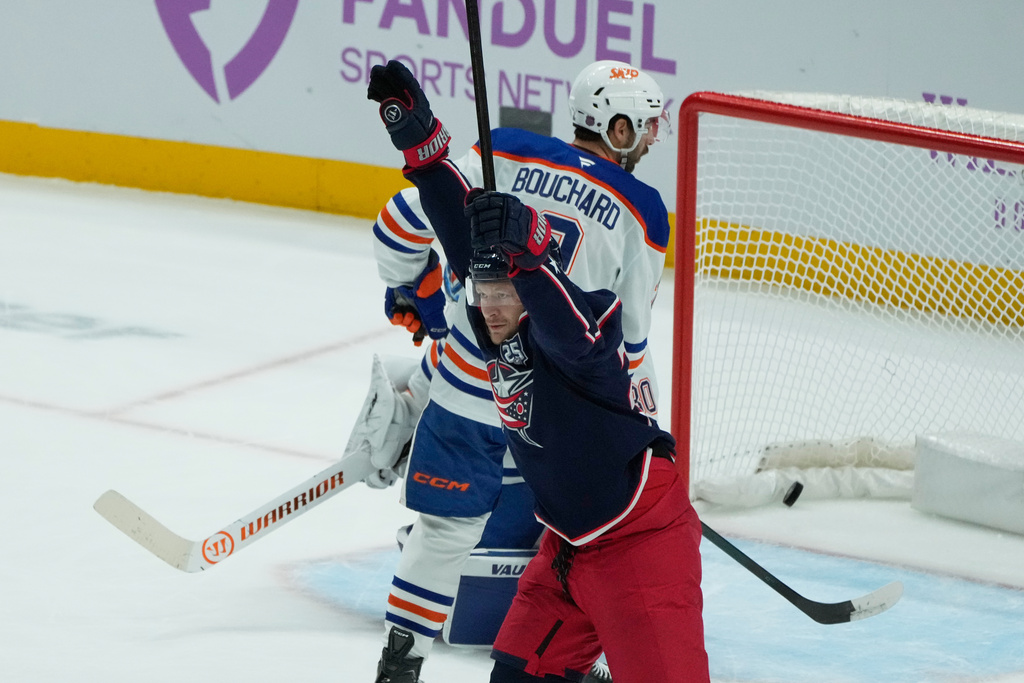 Columbus Blue Jackets right wing Mathieu Olivier (24) celebrates his goal in front of Edmonton Oilers center Curtis Lazar (20) in the first period of an NHL hockey game in Columbus, Thursday, Nov. 13, 2025. (AP Photo/Sue Ogrocki)