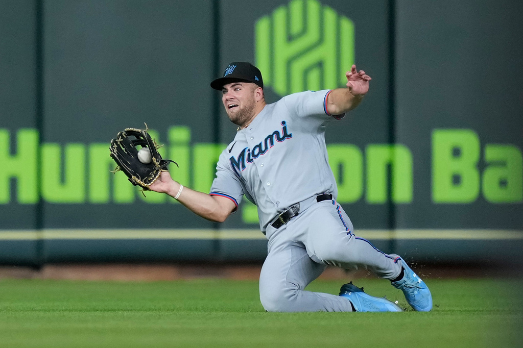 Miami Marlins center fielder Jakob Marsee makes a sliding catch during the sixth inning of a baseball game against the Houston Astros, Tuesday, July 21, 2026, in Houston. (AP Photo/Kevin M. Cox)