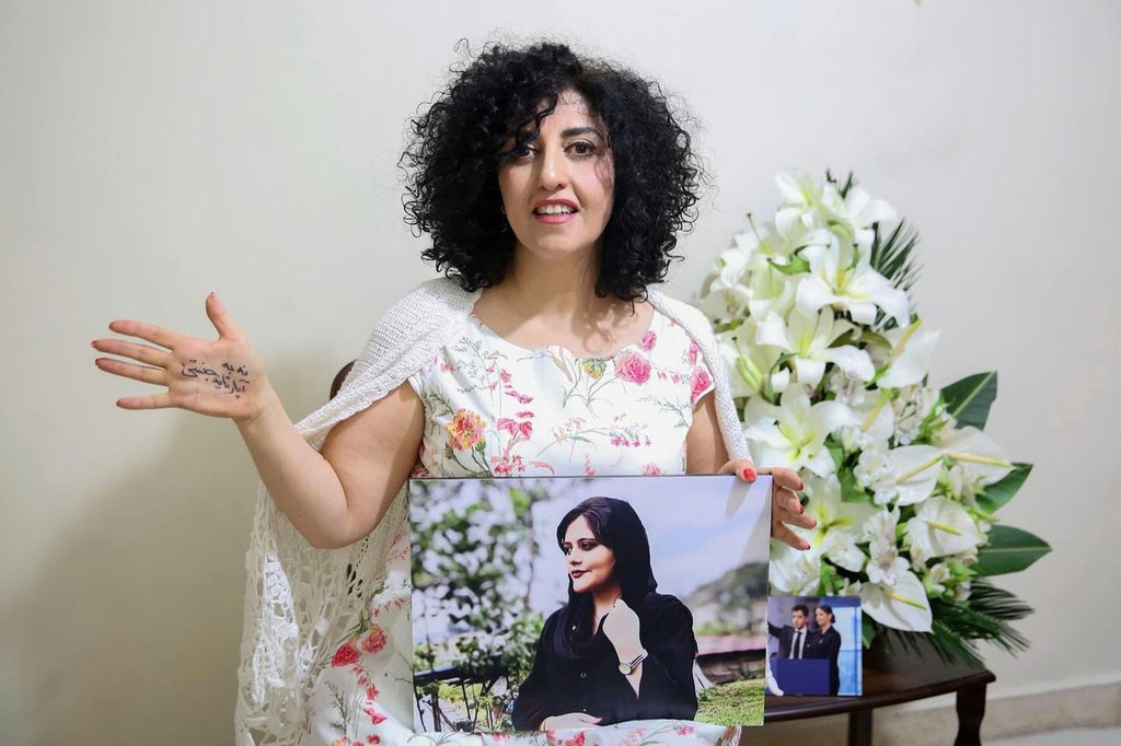 FILE - In this photo released by the Narges Foundation Archive, Nobel Peace Prize laureate Narges Mohammad is seen after being released on a medical furlough in Tehran, Iran, Wednesday, Dec. 4, 2024. On her hand written in Farsi is "End gender apartheid." (Narges Foundation Archive via AP, File)