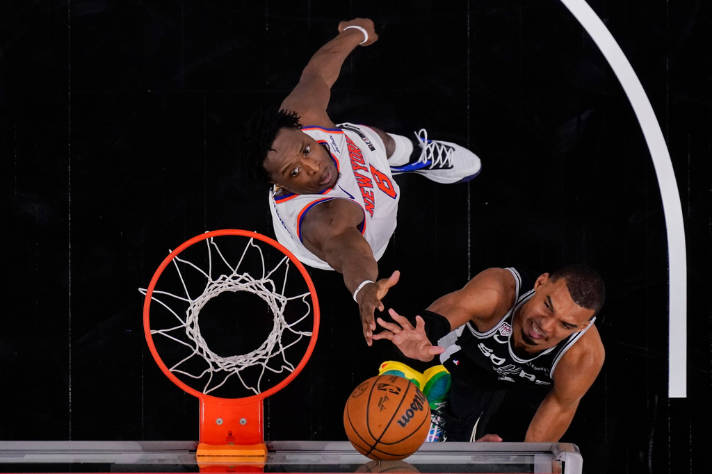 San Antonio Spurs forward Victor Wembanyama shoots over New York Knicks forward Og Anunoby (8) during the second half of Game 1 of the NBA Finals basketball series, Wednesday, June 3, 2026, in San Antonio. (AP Photo/Eric Gay)