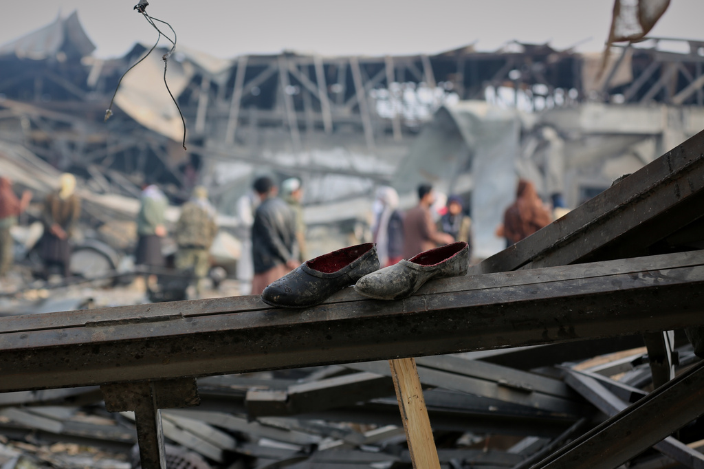FILE - Residents and rescue workers inspect the site of a late-Monday airstrike at a drug rehabilitation hospital in Kabul, Afghanistan, Tuesday, March 17, 2026. (AP Photo/Siddiqullah Alizai, File)