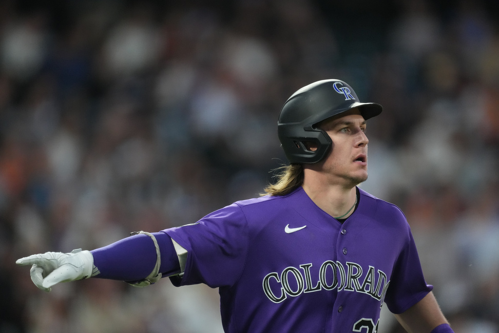 Colorado Rockies' Jake McCarthy gestures to the dugout as he heads up the first base line after hitting a two-run home run off San Francisco Giants starting pitcher Adrian Houser in the fourth inning of a baseball game Saturday, May 30, 2026, in Denver. (AP Photo/David Zalubowski)