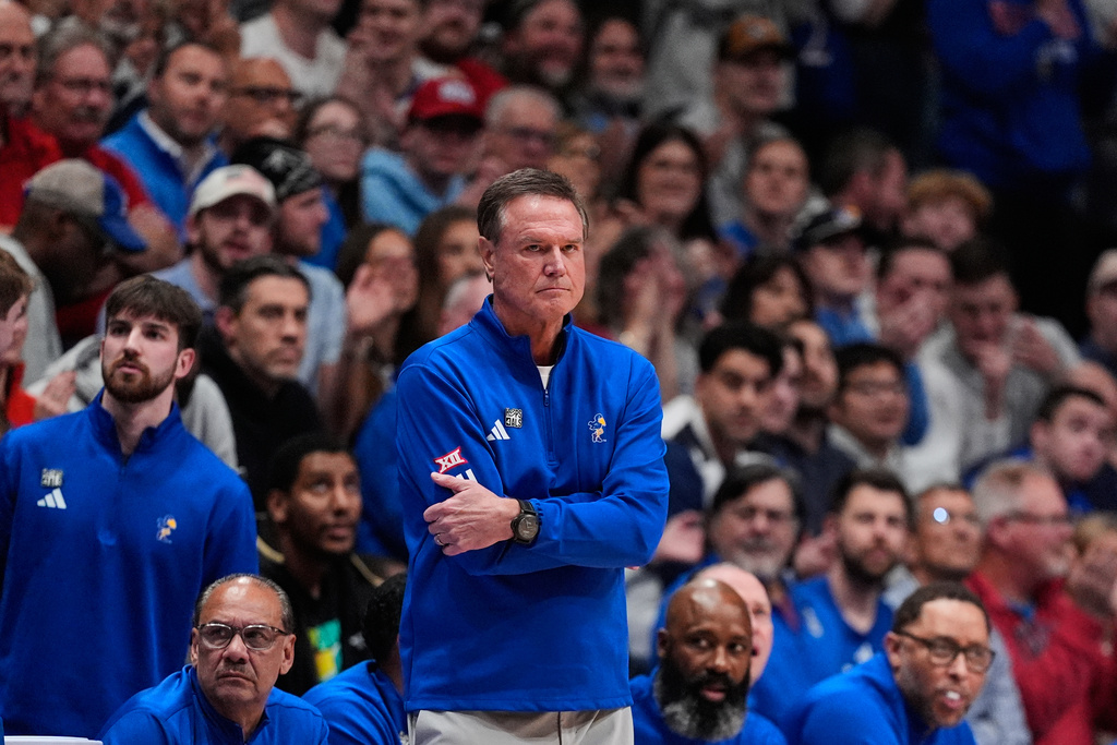 Kansas head coach Bill Self watches during the first half of an NCAA college basketball game against UConn, Tuesday, Dec. 2, 2025, in Lawrence, Kan. (AP Photo/Charlie Riedel)
