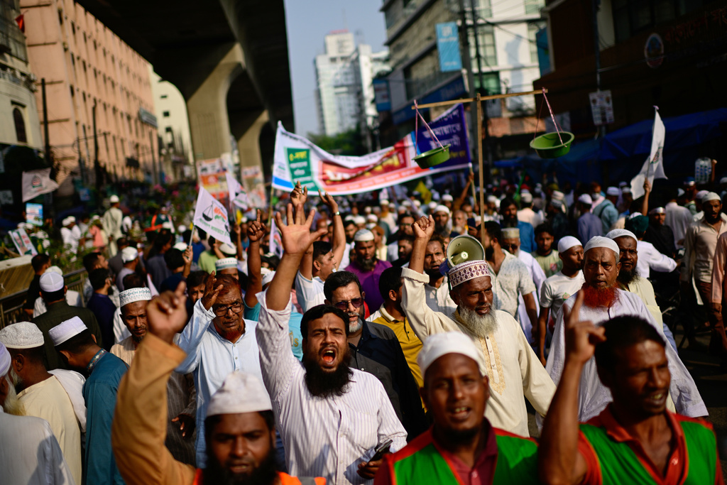 Supporters of Bangladesh's Jamaat-e-Islami and seven allied political parties shout slogans during a rally to present their demands before the next general election, expected to be held in February, in Dhaka, Bangladesh, Tuesday, Nov. 11, 2025. (AP Photo/Mahmud Hossain Opu)