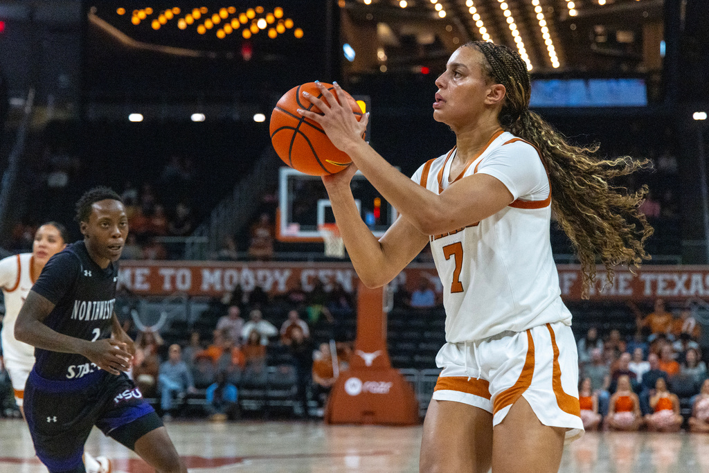 Texas guard Jordan Lee looks to shoot over Northwestern State guard Momina Kassim during the first half of an NCAA college basketball game Wednesday, Dec. 17, 2025, in Austin, Texas. (AP Photo/Stephen Spillman)