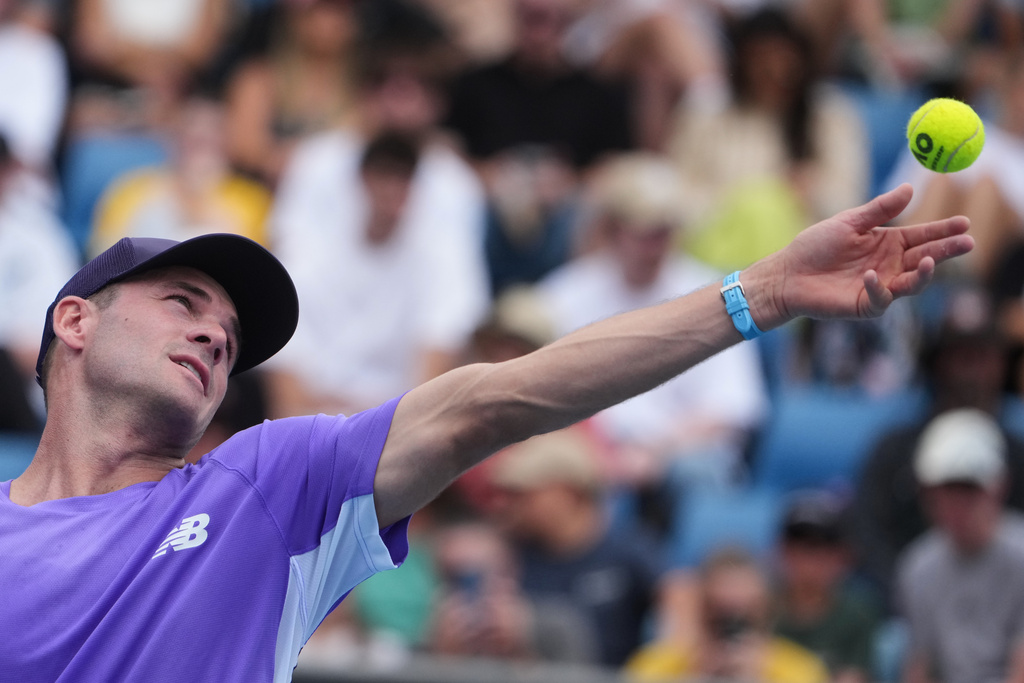 Tommy Paul of the U.S. serves to Thiago Agustin Tirante of Argentina during their second round match at the Australian Open tennis championship in Melbourne, Australia, Wednesday, Jan. 21, 2026. (AP Photo/Asanka Brendon Ratnayake)
