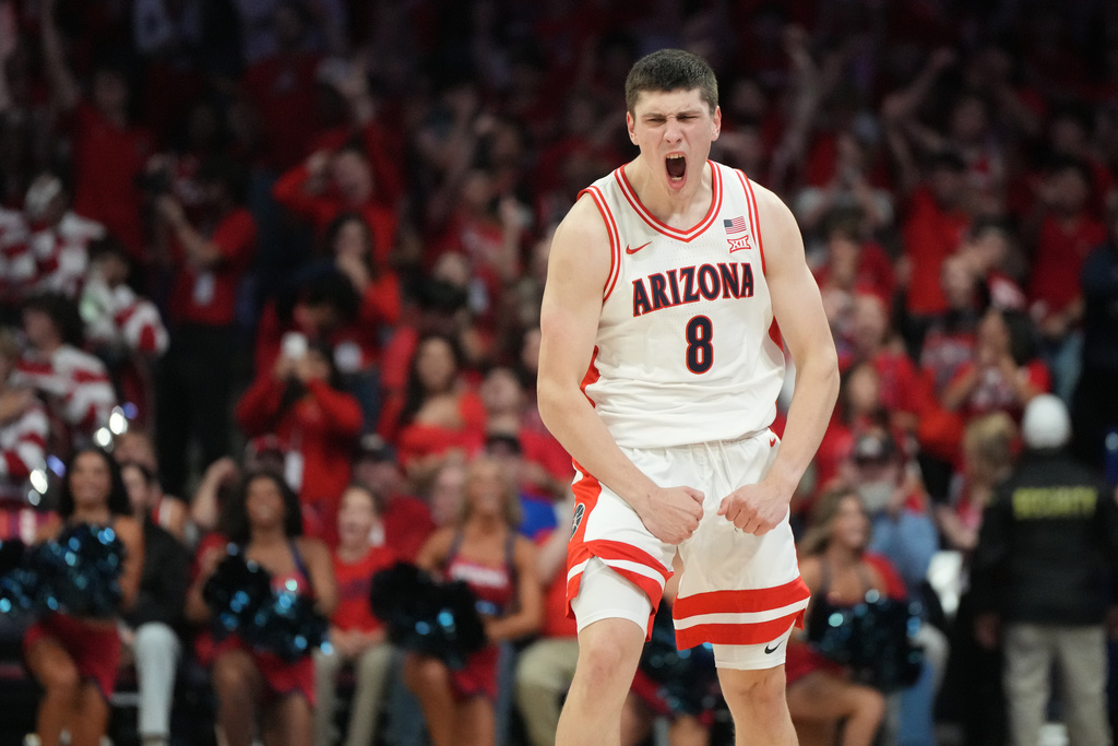 Arizona forward Ivan Kharchenkov reacts after scoring against Auburn during the first half of an NCAA college basketball game, Saturday, Dec. 6, 2025, in Tucson, Ariz. (AP Photo/Rick Scuteri)